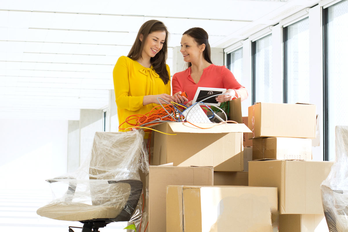 Two girls with boxes 
